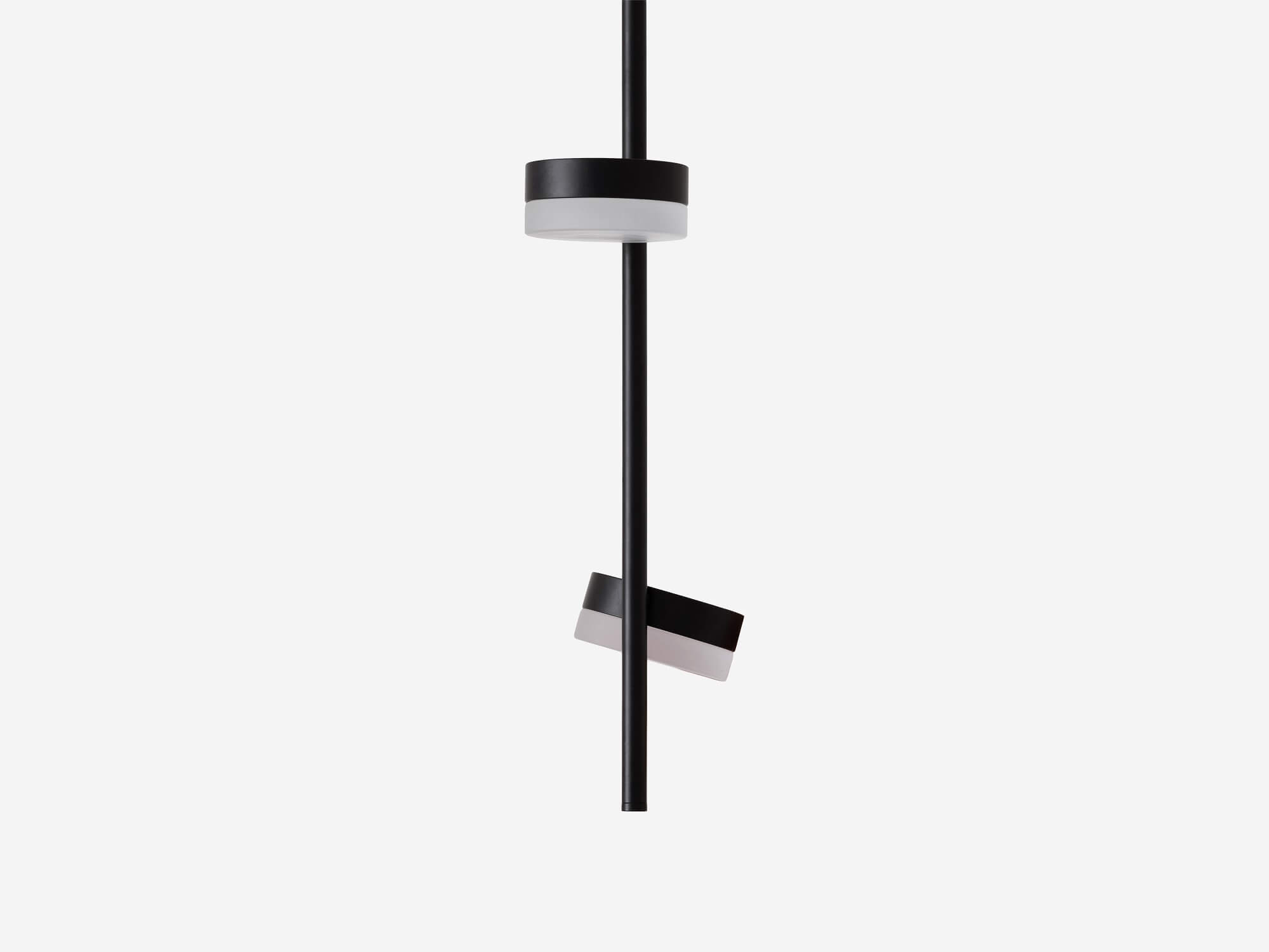 A hand demonstrates how to move the Row double pendant lighting